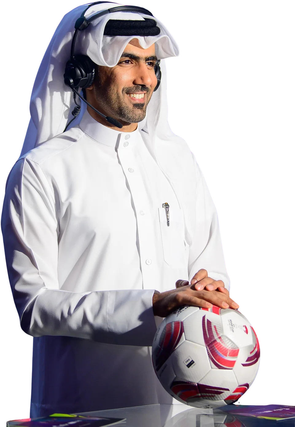 Mohammed Saadon Al Kuwari with a broadcast headset and a match ball